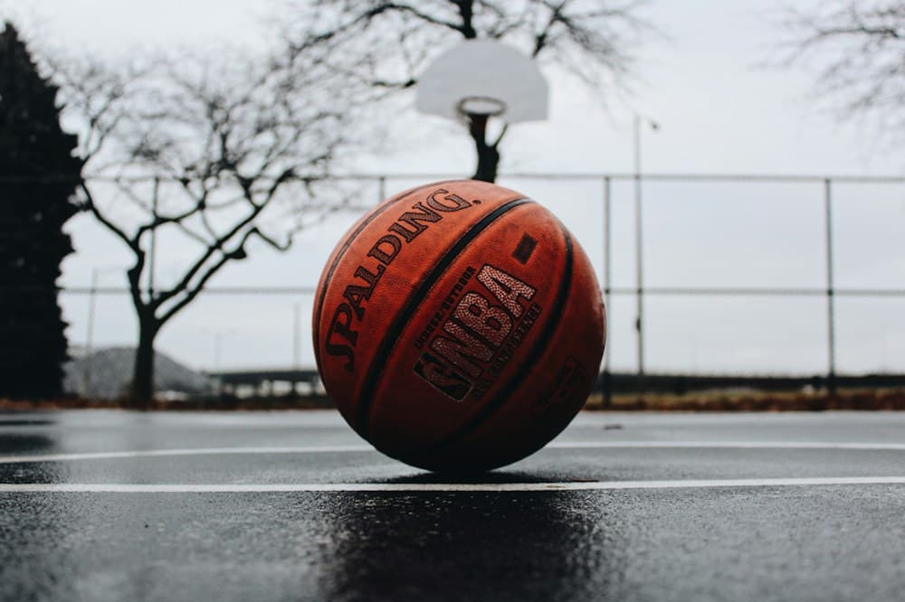 Stock basketball photograph of a ball on an outdoor court